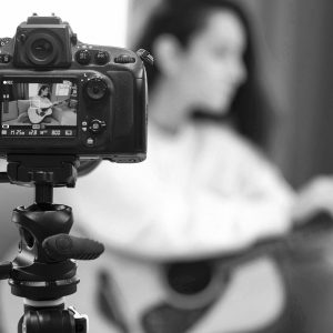 blogger-recording-video-with-guitar-lesson bn